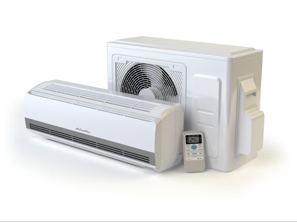 A mini split air conditioner system with a compressor, remote, and indoor vent unit isolated on a white background.
